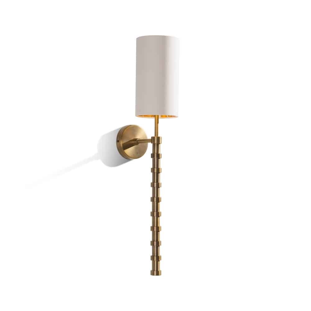 Brass wall light with cream shade