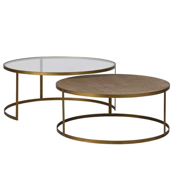 The nest of tables feature beautifully woven rattan surfaces encircled by metal frames in an aged gold finish.