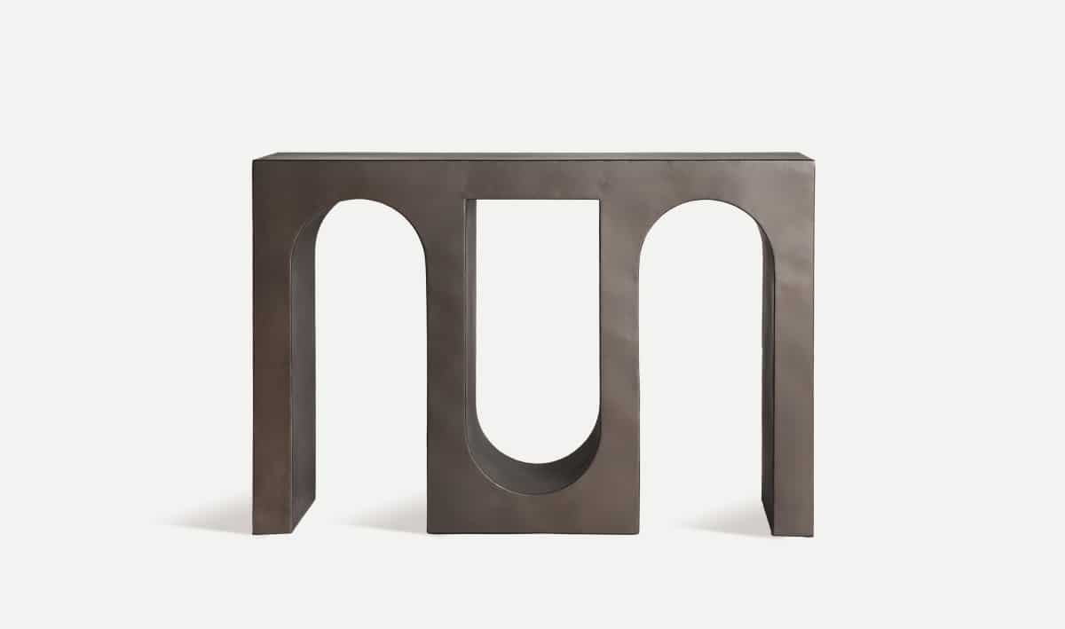 Add modern sophistication to your home with the Rivelle Console, a sculptural grey iron table perfect for hallways and entryways.